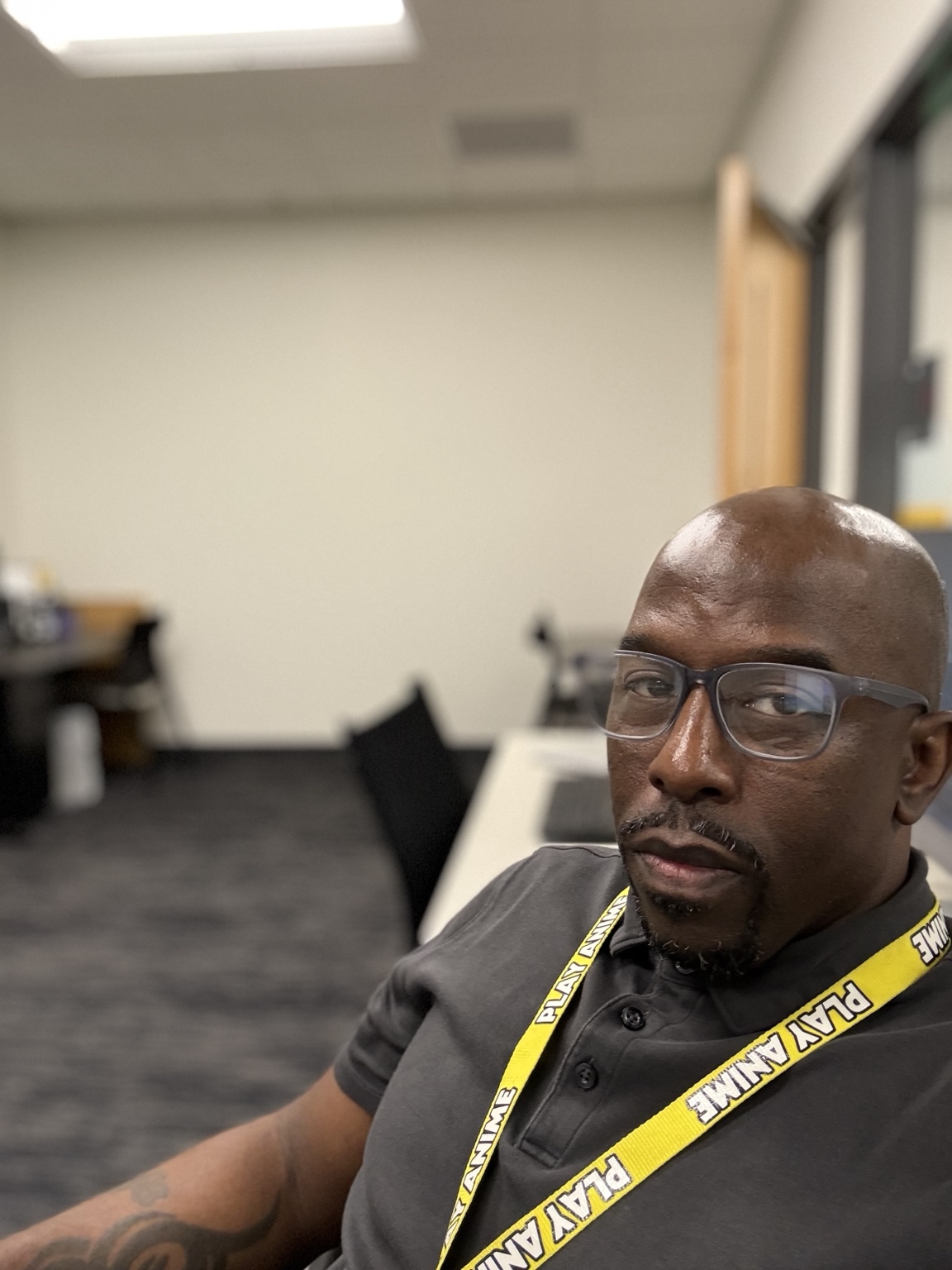 Kwesi in a professional workspace